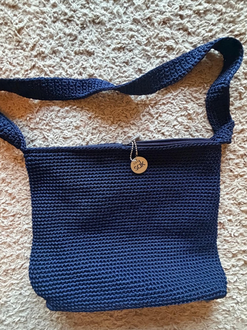 The Sak Navy Crochet Bag with Branded Charm NWOT